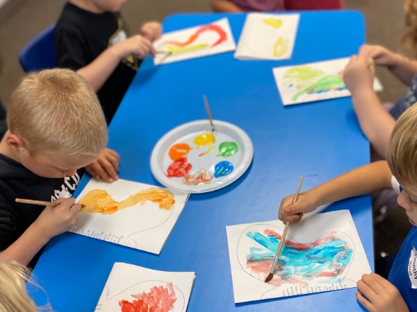 Kids painting at a church program