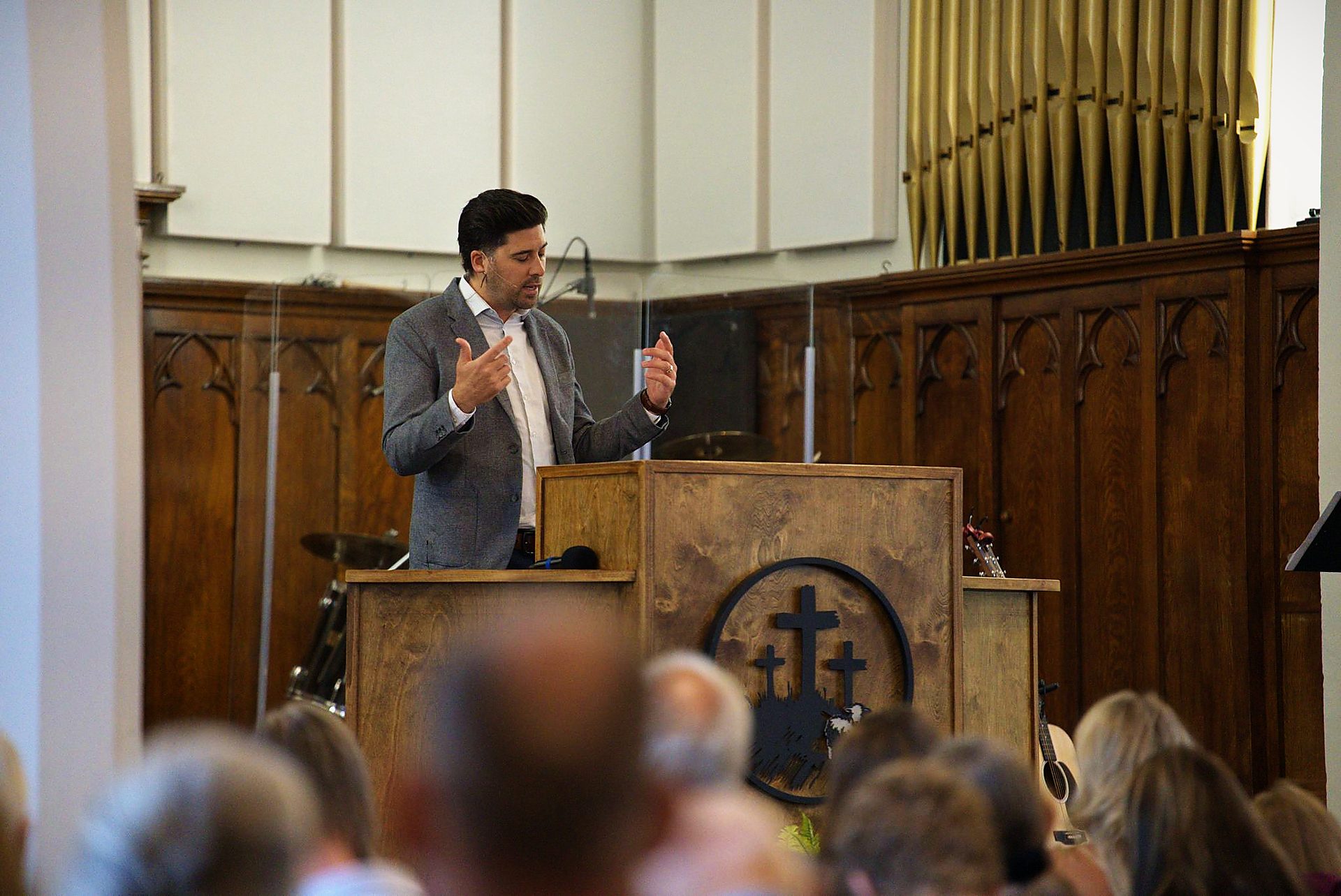 Preaching from the pulpit during a Sunday service